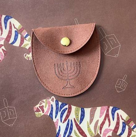 Brown leather pouch with a central emblem on a background with colorful tiger illustrations.